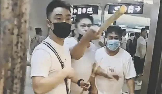  ?? PICTURE: GETTY IMAGES ?? 0 A video still shows men threatenin­g pro-democracy protesters after clashes between the two groups at Yuen Long station in Hong Kong