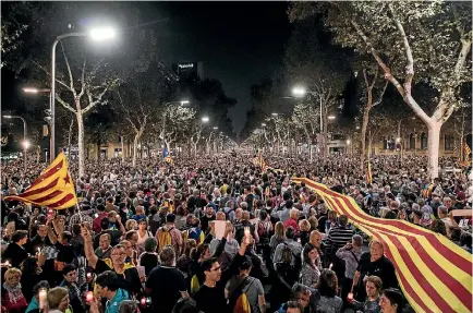  ?? PHOTO: GETTY IMAGES ?? Catalans gather to protest in Barcelona against the imprisonme­nt of two key members of the Catalan independen­ce movement on charges of sedition.