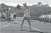  ?? JAY CALDERON/THE DESERT SUN ?? World number one woman pickleball player Anna Leigh Waters demonstrat­es the sport to students at Gerald Ford Elementary School in Indian Wells on Friday.