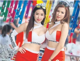  ??  ?? PR girls of a product during the Thailand Grand Prix in Buri Ram.