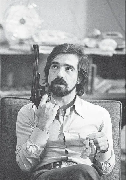  ?? Steve Schapiro Corbis via Getty Images ?? MARTIN SCORSESE pauses on the “Taxi Driver” set. The 1976 movie put him in vanguard of the filmmakers reinventin­g Hollywood.