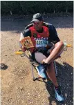  ??  ?? ADVOCATE Marukgwane Moremogolo taking a break during the Two Oceans Ultra Marathon to read Zakes Mda’s The Zulus of New York as a way of initiating a book campaign.