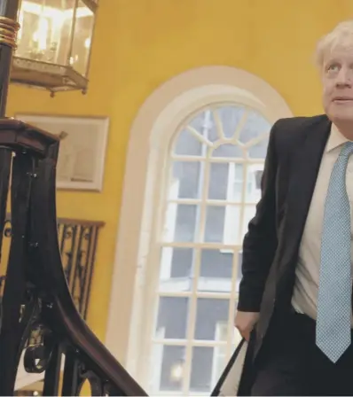  ??  ?? 0 Boris Johnson climbs the No. 10 Downing Street stairs on his way to a press conference. He insists it is not worth talking to the EU next week