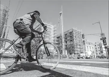  ?? Robert Gauthier Los Angeles Times ?? BUILDING continues on a supportive-housing project on 7th Street in downtown L.A. A nonprofit is suing because it was rejected for nearly $25 million in funding from Propositio­n HHH, a $1.2-billion bond measure.