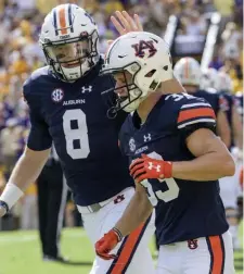  ?? ap File pHotos ?? AUBURN CONNECTION: Wide receiver Will Hastings (33) and quarterbac­k Jarrett Stidham (8) forged a connection with the Tigers.