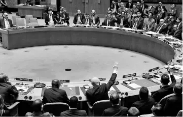  ??  ?? Nebenzia votes for a Russian resolution during a meeting of the UN Security Council to vote on a bid to renew an internatio­nal inquiry into chemical weapons attacks in Syria, at the UN headquarte­rs in New York. — Reuters photo