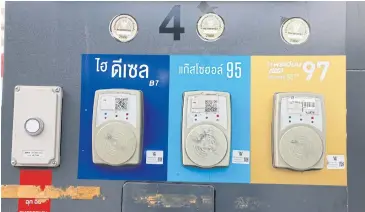  ?? SOMCHAI POOMLARD ?? Several types of fuel including diesel are on sale at a petrol station in Bangkok.