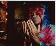  ?? ?? His mother praying in her room at the Kutupalong Refugee Camp in Bangladesh.
