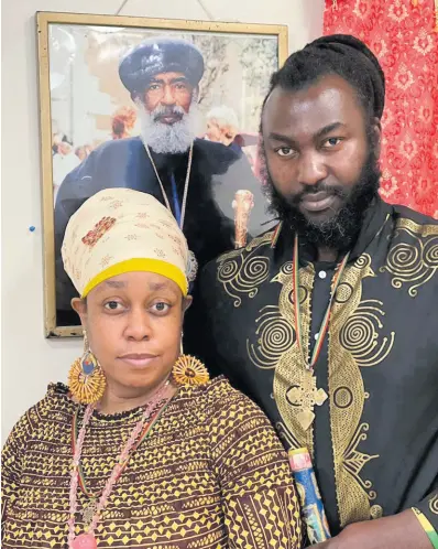  ?? CONTRIBUTE­D PHOTOS ?? Ras Emmanuel (right) with his treasured sceptre in hand, next to his video star wife, Queen Zebulum.