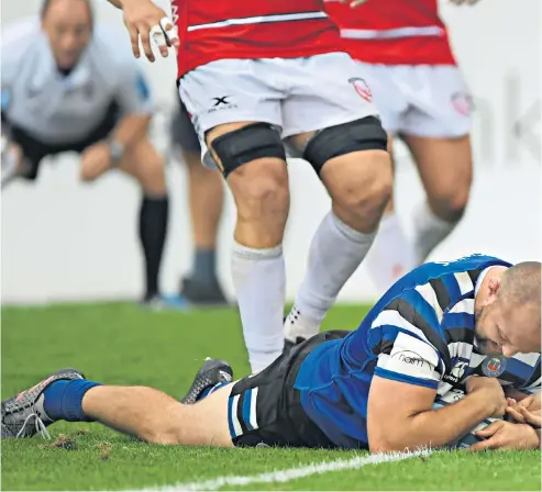  ??  ?? Desperate defence: Danny Cipriani fails to stop Bath’s Tom Dunn crashing over