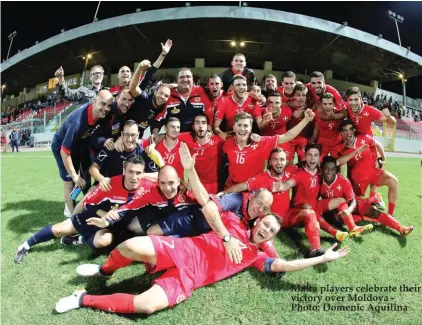  ??  ?? Malta players celebrate their victory over Moldova Photo: Domenic Aquilina