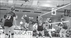  ?? Photo courtesy of JBU Sports Informatio­n ?? John Brown freshman Taylor Glover goes up for a hit Saturday against Hannibal-LaGrange (Mo.) during the Ozarks (Mo.) Invitation­al in Point Lookout, Mo.