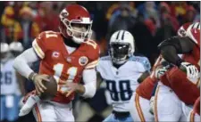  ?? ED ZURGA — ASSOCIATED PRESS ?? Quarterbac­k Alex Smith carries the ball during the Chiefs’ wild-card playoff game loss Jan. 6 to the Titans.