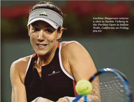  ?? EPA PIC ?? Garbine Muguruza returns a shot to Sachia Vickery in the Paribas Open in Indian Wells, California on Friday.