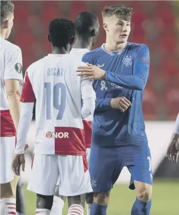  ??  ?? Rangers’ Nathan Patterson, right, and Slavia Prague’s Oscar Dorley at full-time on Thursday