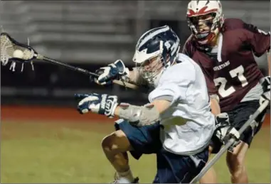  ?? ED Burke/eburke@saratogian.com ?? Saratoga’s Bobby Frank is upended by Burnt Hills-Ballston Lake’s Logan Ball during a varsity lacrosse game Wednesday in Saratoga Springs.