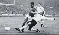  ?? PICTURES: PETER COTTLE/ALLSPORT HULTON/ARCHIVE ?? GOLDEN DAYS: Above, World Cup winner Ray Wilson; inset, Wilson slides in to challenge France’s Phillipe Gondet at Wembley Stadium in 1966.