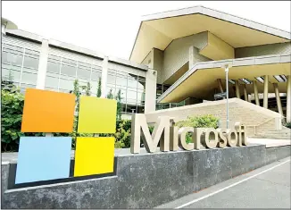  ??  ?? This July 3, 2014 file photo shows Microsoft Corp. signage outside the Microsoft Visitor Center in Redmond, Washington. The volume of option contracts to buy or sell Microsoft and Tesla shares is up more than twofold from 2019,
while Apple option contract volume is up more than 86%. (AP)