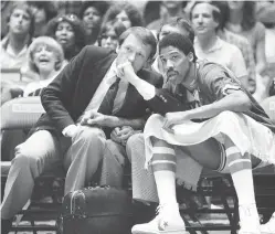  ?? AP Photo/Rusty Kennedy, File ?? ■ Philadelph­ia 76ers coach Billy Cunningham, left, confers with Julius Erving June 7, 1982, during the fourth quarter of an NBA playoff game at Philadelph­ia.