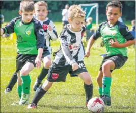  ?? Picture: Matthew Walker FM4806316 ?? Ashford (green) take on K Sports at the Barming Youth tournament