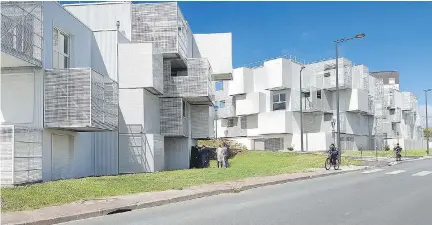  ?? FACEBOOK ?? The White Clouds public housing project features caged balconies, giving each apartment more living space.