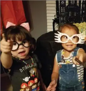  ?? ASSOCIATED PRESS ?? This August 2018 photo provided by Selah Hovda shows two guests practicing spells during her son’s Harry Potter-themed birthday party in Phoenix, Ariz. Hovda says the guests’ favorite part of the party was having spell battles with homemade wands.