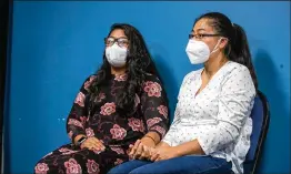  ??  ?? Leslie Barrera (left), mother of Mateo Alejandro Montufar-Barrera, sits with her aunt at the Chamblee Police Station. Police said Barrera fought strenuousl­y as a couple kidnapped her 1-year-old son.