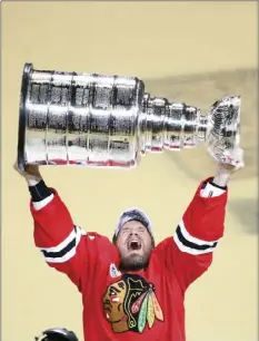  ??  ?? In this June 10, 2015, file photo, Chicago Blackhawks' Kimmo Timonen, of Finland, hoists the Stanley Cup trophy after defeating the Tampa Bay Lightning in Game 6 of the NHL hockey Stanley Cup Final series in Chicago. AP PHOTO