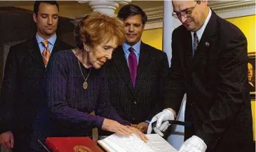  ?? Eric Parsons/Associated Press ?? Former first lady Nancy Reagan and supervisor­y archivist Mike Duggan, right, place some of former President Ronald Reagan's original diaries on display at the Ronald Reagan Presidenti­al Library May 21, 2007, in Simi Valley, Calif. Presidents from George Washington to Joe Biden have kept presidenti­al diaries. In them, they confide in themselves, express raw opinions, trace even the humdrum habits of their day and offer insight-on-the-fly on monumental decisions of their time. It's where they may also spill secrets they shouldn't.