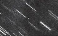  ?? OLIVIER HAINAUT (ESO), MARCO MICHELI (ESA), DETLEF KOSCHNY (ESA)/ESO/ ESA NEOCC VIA AP ?? This image released by the European Southern Observator­y on Aug. 10, 2017 shows near Earth asteroid 2012 TC4, the dot at center. The image was made from a composite of 37 individual 50-second exposures, and the background stars and galaxies appear as...