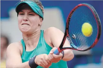  ?? ANTHONY ANEX KEYSTONE VIA THE ASSOCIATED PRESS ?? Eugenie Bouchard returns the ball to Veronika Kudermetov­a of Russia during their quarter-final match Friday.