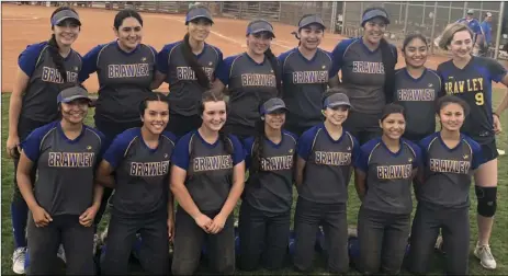  ?? PHOTO COURTESY OF KEVIN KERNS ?? Members of the Brawley Union High softball team smile for a photo after a game at the Spring Jamorbee in Las Vegas last week. The Wildcats went 5-1 in the tournament, winning third place.