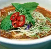  ??  ?? Penang assam laksa is another popular rendition of laksa that has a broth that includes the use of tamarind, fish and belacan. — Filepic