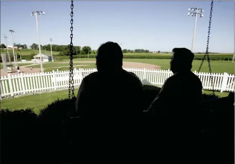  ?? CHARLIE NEIBERGALL — THE ASSOCIATED PRESS ?? New Mexico Gov. Bill Richardson, left, at the time a candidate for the Democratic presidenti­al nomination, sits on the front porch of the house at the “Field of Dreams” movie site during a 2007 campaign stop in Dyersville, Iowa. The Chicago White Sox will play a game against the New York Yankees next August at the site in Iowa where the movie “Field of Dreams” was filmed.