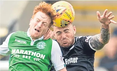  ?? SNS. ?? Kerr Waddell challenges former Dundee United striker Simon Murray during the recent clash with Hibs.