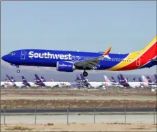  ?? AP PHOTO/MATT HARTMAN ?? In this March 23 file photo, a Southwest Airlines Boeing 737 Max aircraft lands at the Southern California Logistics Airport in the high desert town of Victorvill­e, Calif.