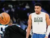  ?? Aaron Gash/Associated Press ?? The Bucks’ Giannis Antetokoun­mpo warms up before the second half against the Heat on Feb. 4.