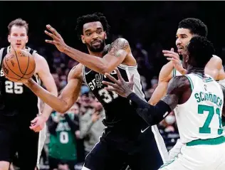  ?? Charles Krupa / Associated Press ?? The Spurs took on the Rockets on the road Tuesday without Keita Bates-diop after the backup forward became the team’s 12th player to be put into the COVID-19 health and safety protocols.