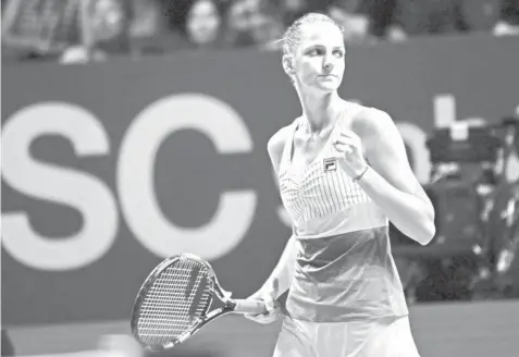  ?? AGENCE FRANCE PRESSE ?? Karolina Pliskova of the Czech Republic reacts on a point against Venus Williams of the US during the WTA Finals tennis tournament in Singapore.