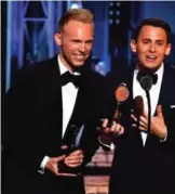  ??  ?? Justin Paul, left, and Benj Pasek accept the award for best original score (music and lyrics) written for the theatre for "Dear Evan Hansen".