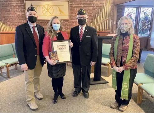  ?? David Pizzolo / First Reformed Church ?? Elizabeth Whalen, Albany County health commission­er, holds the 2021 Four Chaplains Brotherhoo­d Award she received from Jewish War Veterans Capital District Council Commander Richard Goldenberg, left, and Albany Post 105 Jewish War Veterans Commander Fred Altman at the First Reformed Church in Schenectad­y. At right, Senior Pastor Lynn Bodden looks on.