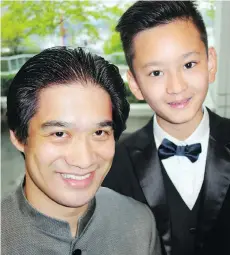  ??  ?? Vancouver Metropolit­an Orchestra music director Ken Hsieh conducted Ryan Wang, 10, playing Beethoven’s Piano Concerto No. 2.