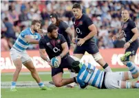  ?? AFP ?? England’s Ellis Genge (centre) is tackled by Argentina’s Matias Alemanno (right) and wing Ramiro Moyano. —