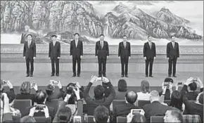  ??  ?? Xi Jinping(C), general secretary of the Central Committee of the Communist Party of China (CPC), and the other newly-elected members of the Standing Committee of the Political Bureau of the 19th CPC Central Committee Li Keqiang (3rd R), Li Zhanshu (3rd...