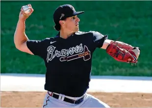  ?? CURTIS COMPTON/CURTIS.COMPTON@AJC.COM ?? Braves pitcher Kyle Wright does a morning workout session Friday at spring training in Cooltoday Park in North Port, Florida. Wright, 25, could open the season in the rotation if Mike Soroka, returning from a torn Achilles, begins the season on the injured list.