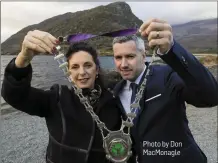  ?? Photo by Don MacMonagle ?? Pictured at Eagle’s Nest Mountain, Paul O’Neill, new President of Killarney Chamber of Tourism & Commerce, accepts the chain of office from outgoing president Kate O’Leary on New Years Eve.