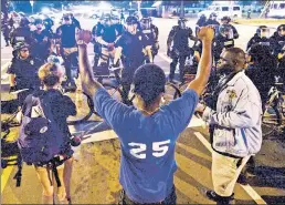  ??  ?? Driven by a falsehood: Protesters rage over myth cops treat blacks unfairly.