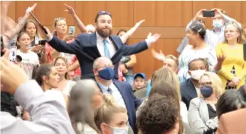  ?? MELINDA DESLATTE/AP ?? A crowd of angry, largely unmasked people objecting to Louisiana Gov. John Bel Edwards’ mask mandate for schools shouts in opposition to wearing a face covering Wednesday in Baton Rouge.