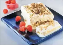  ??  ?? Amaretti semifreddo is garnished with raspberrie­s and the light Italian cookie.