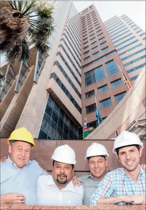  ??  ?? TIGHT TEAM: Dave Heron of Murray and Roberts, Shaun Rai of Stonehill Property Fund, Juan Hugo of JW Hugo Constructi­on and David Cohen of Signatura outside the Radisson Blu Hotel and Residence Cape Town.